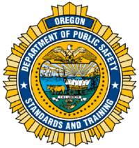 Seal of the Oregon Department of Public Safety Standards and Training, featuring symbols like an eagle, shield, ox, and covered wagon.