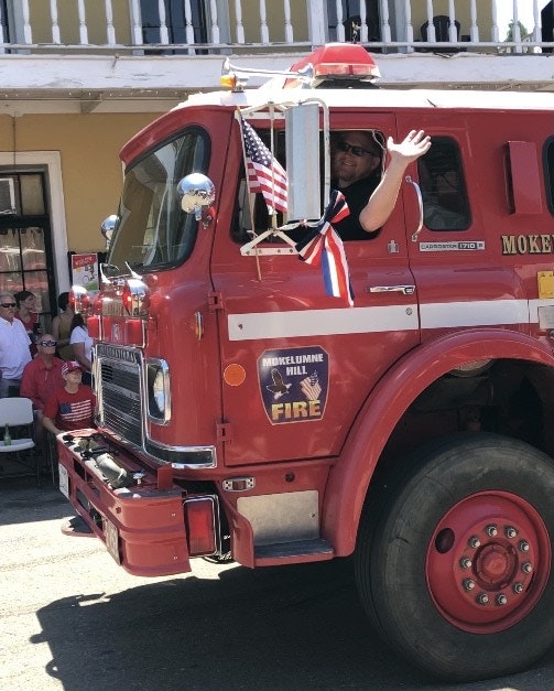 May contain: person, human, truck, vehicle, transportation, and fire truck