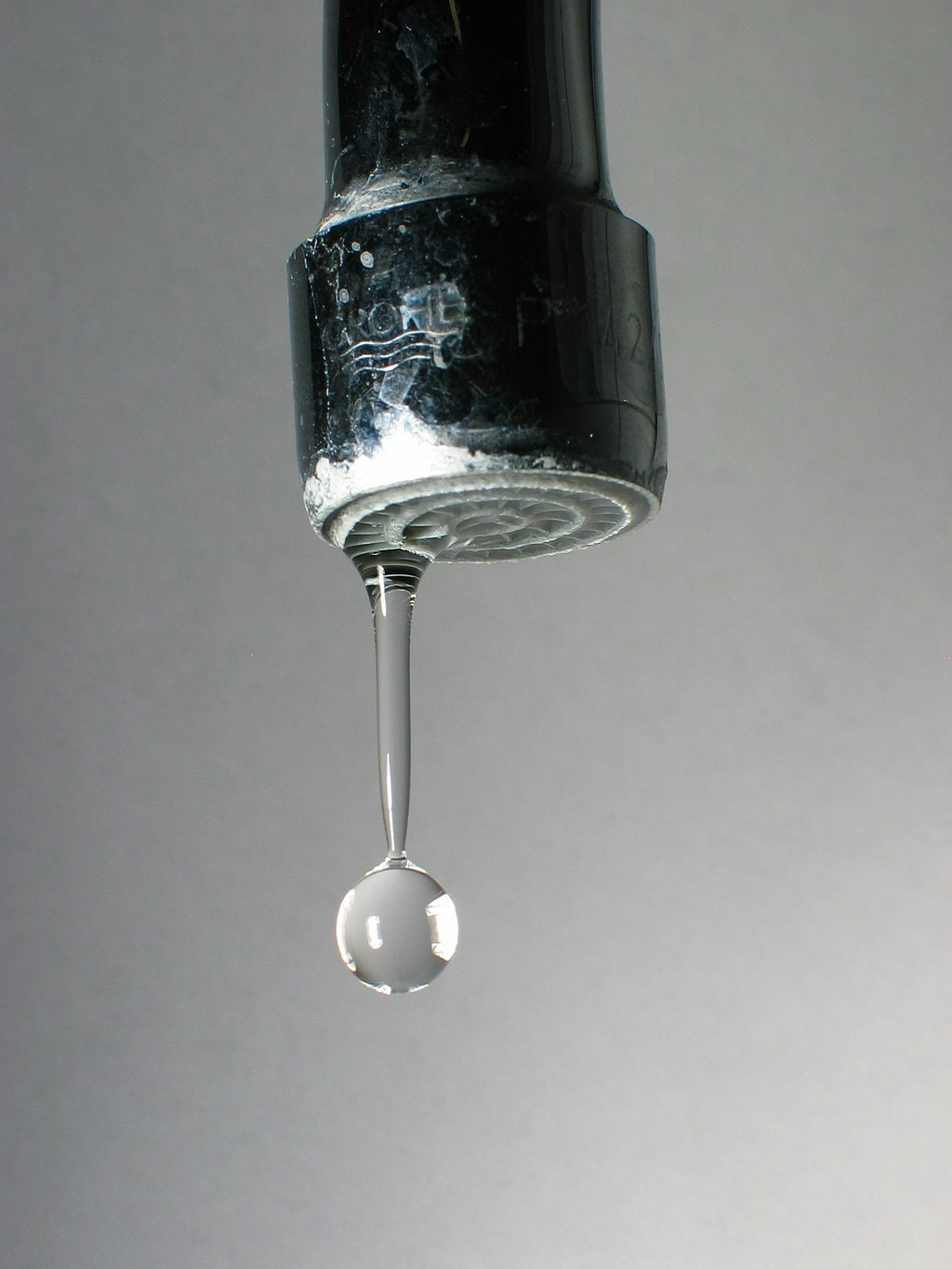 stainless steel faucet with a single droplet