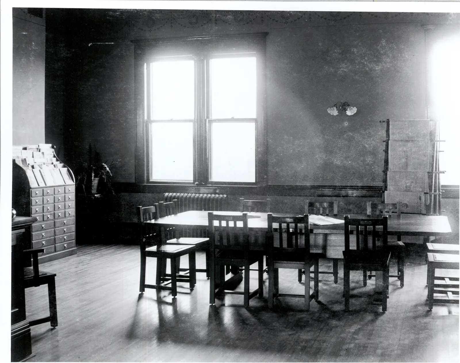 May contain: architecture, building, dining room, dining table, furniture, indoors, room, table, floor, chair, classroom, school, restaurant, and flooring