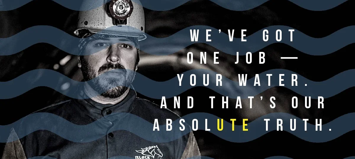 A man with a hard hat, wavy lines, and a water-related message.