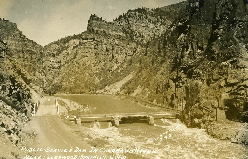 Vintage photo of a dam in Colorado River near Glenwood Springs, CO, with a road alongside the river.