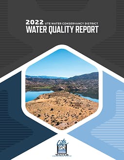 The image shows the cover of the "2022 UTE Water Conservancy District Water Quality Report" featuring a landscape with water and arid land.