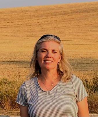 May contain: blonde, hair, person, face, head, photography, portrait, blouse, clothing, body part, neck, accessories, jewelry, and necklace