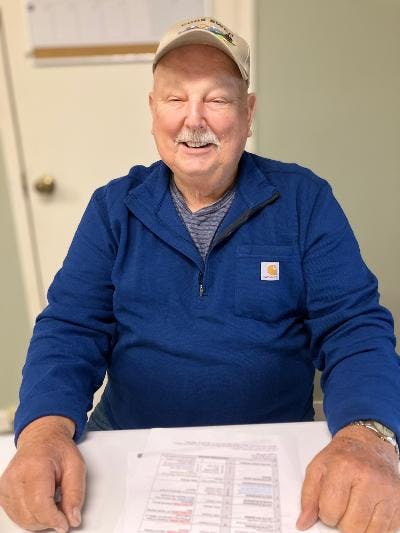 Treasurer sitting at his desk.