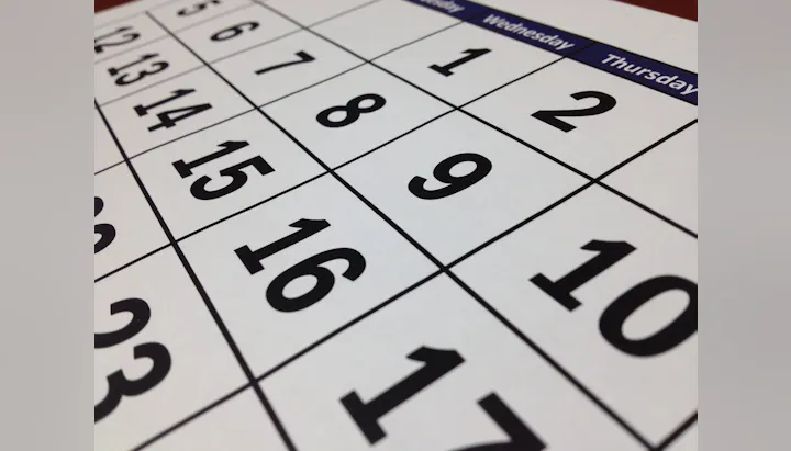 The image shows a close-up of a calendar page with visible dates and days of the week.
