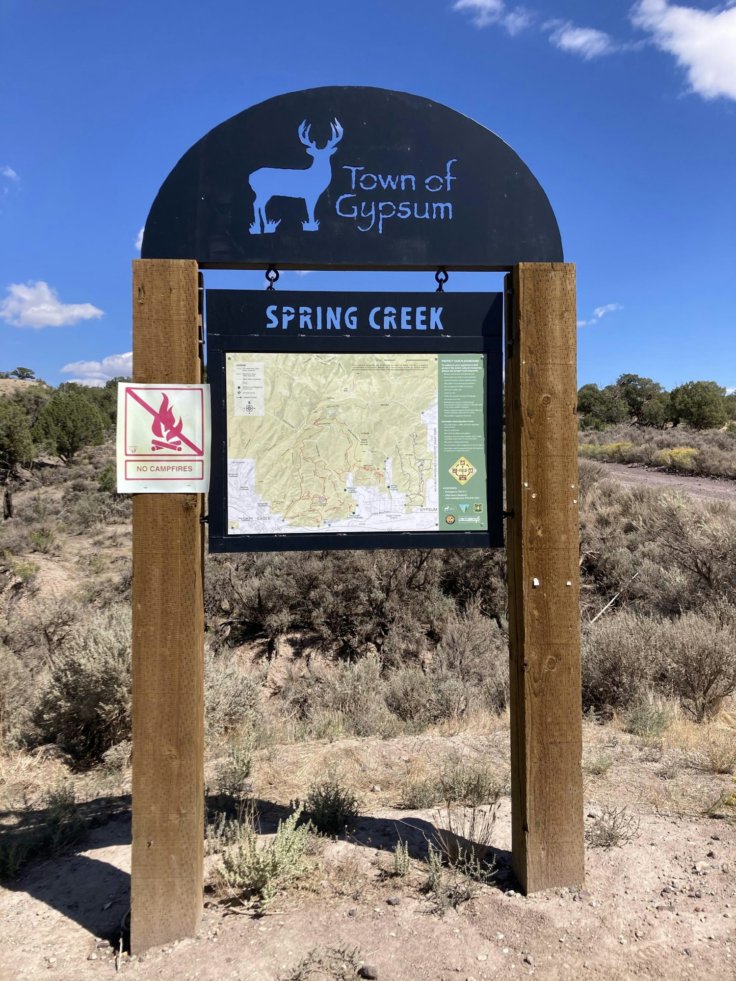 Sign for "Town of Gypsum" at Spring Creek; includes a map and a "No Campfires" warning.