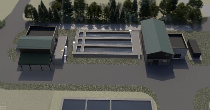 Aerial view of architectural structures and rectangular pools, surrounded by trees.