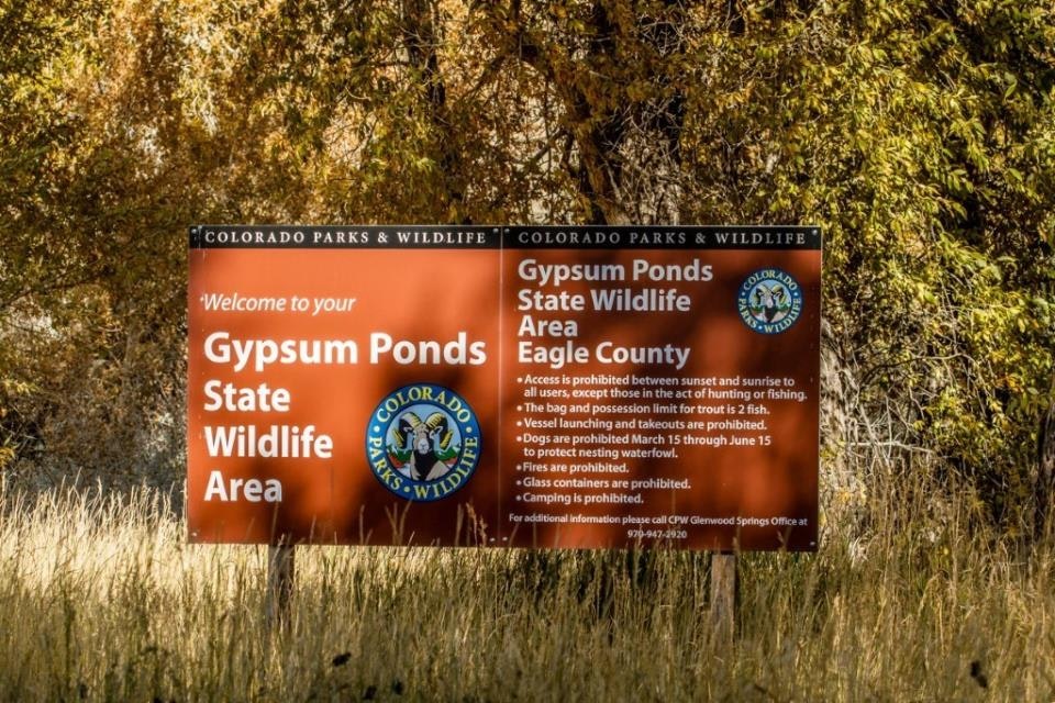 Sign for Gypsum Ponds State Wildlife Area, Eagle County, with rules and regulations from Colorado Parks & Wildlife.