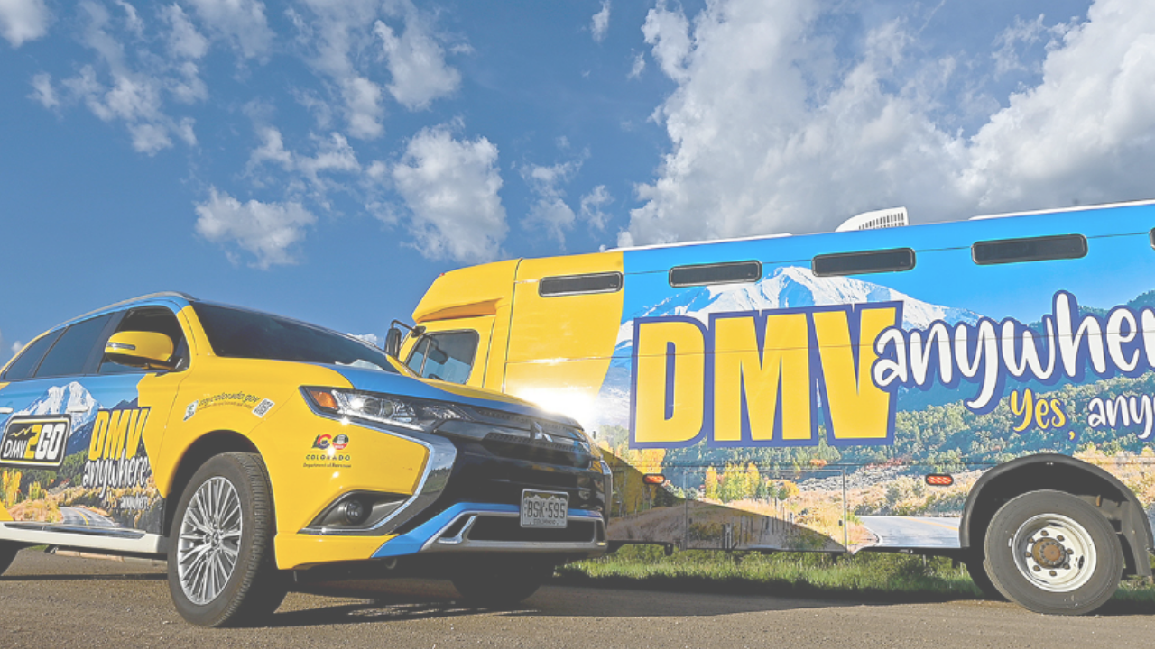 Two vehicles with "DMV Anywhere" branding, featuring a mountain landscape design under a cloudy blue sky.