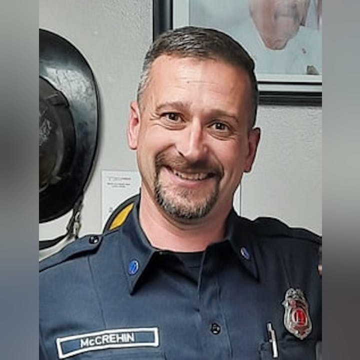 May contain: officer, person, police officer, adult, male, man, and captain