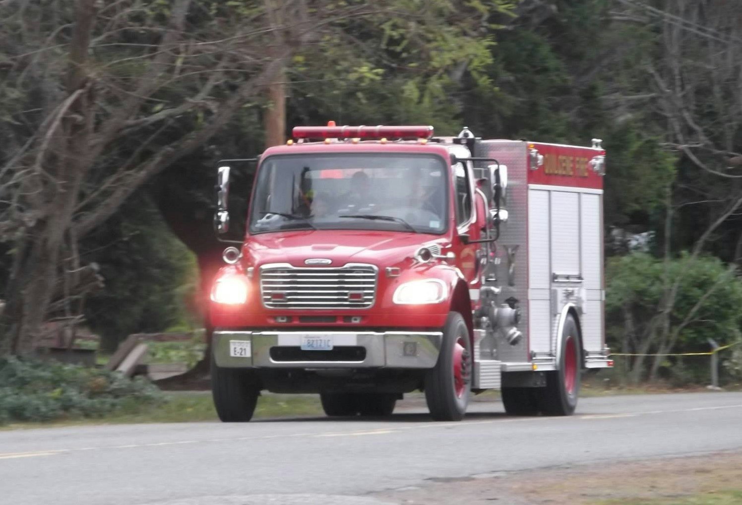 Fire engine traveling on road