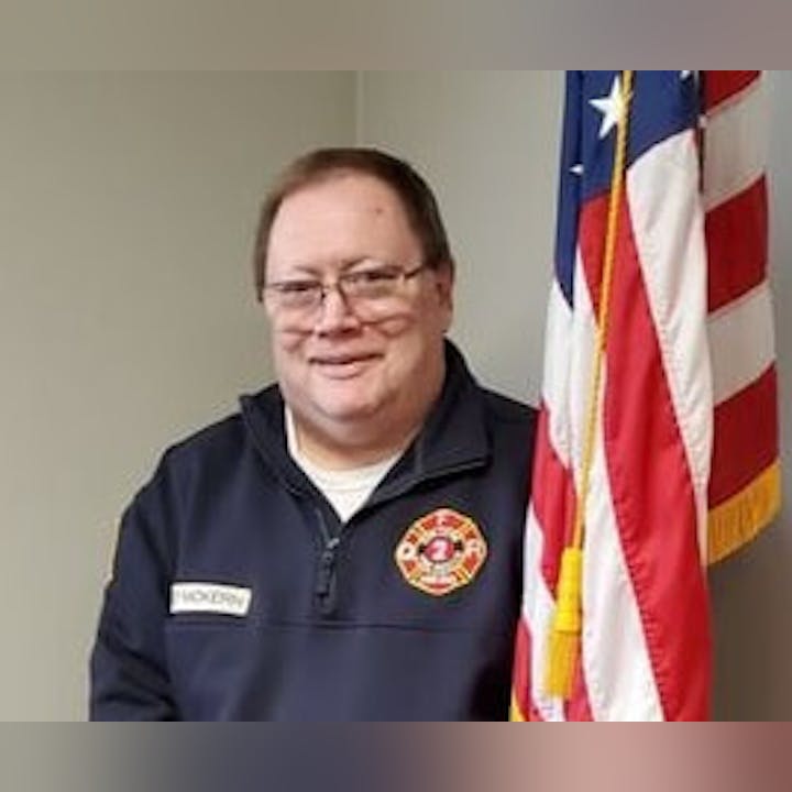 May contain: adult, male, man, person, american flag, and flag