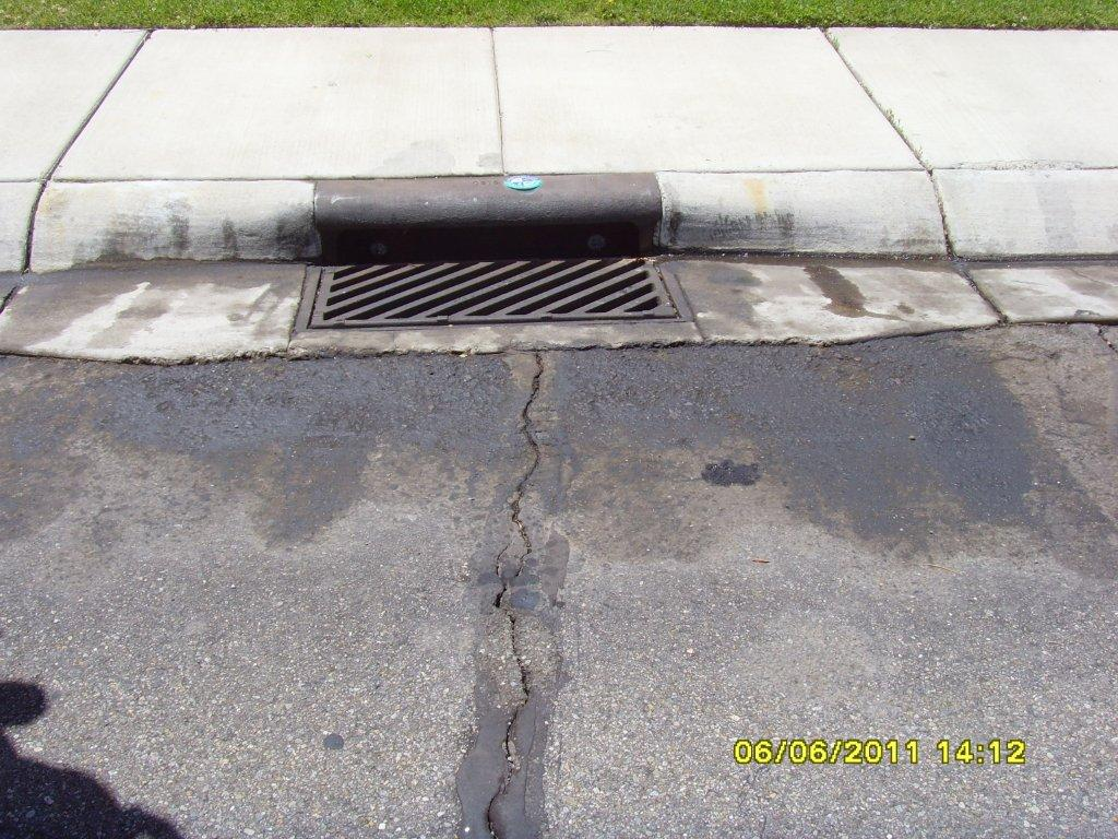 May contain: path, sidewalk, drain, and road