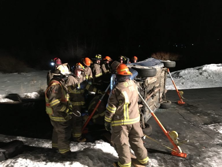 firefighters on the scene of a car accident