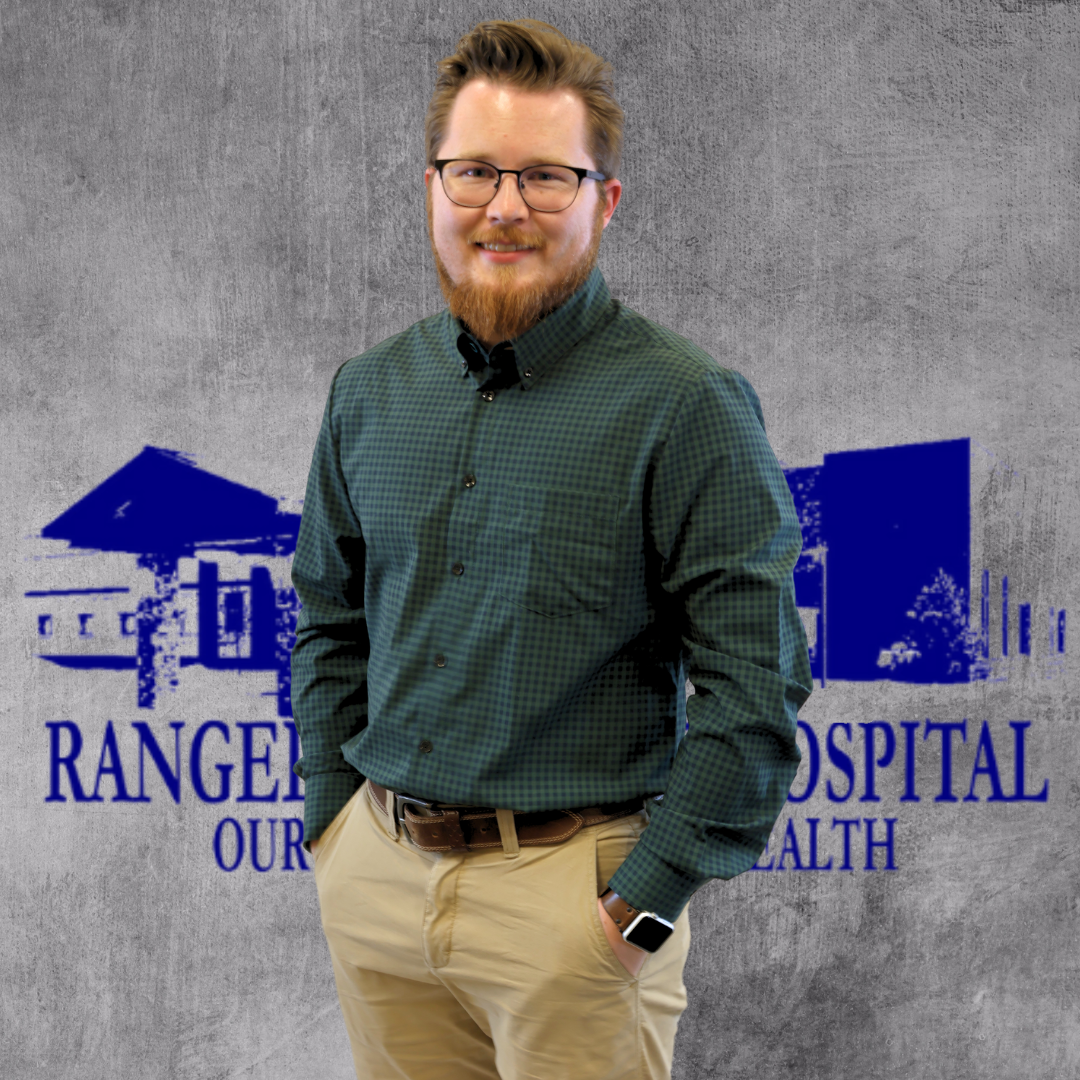 A man in business-casual attire with a graphic for "RANGE HOSPITAL OUR HEALTH" in the background.