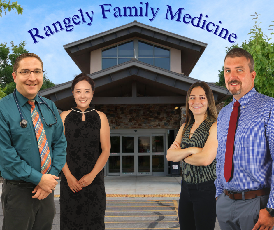 Four people stand in front of a building labeled "Rangely Family Medicine."