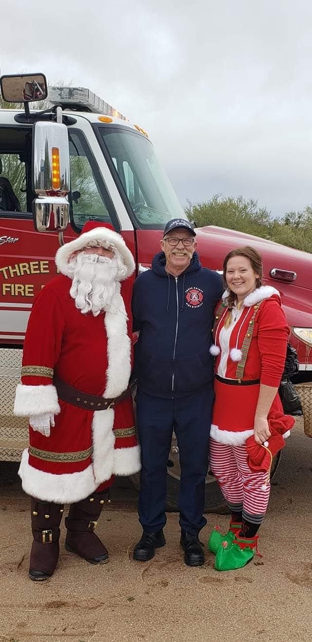 May contain: festival, christmas, person, santa claus, clothing, hoodie, knitwear, sweater, and sweatshirt