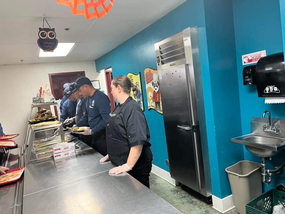 May contain: cafeteria, indoors, restaurant, person, adult, male, and man