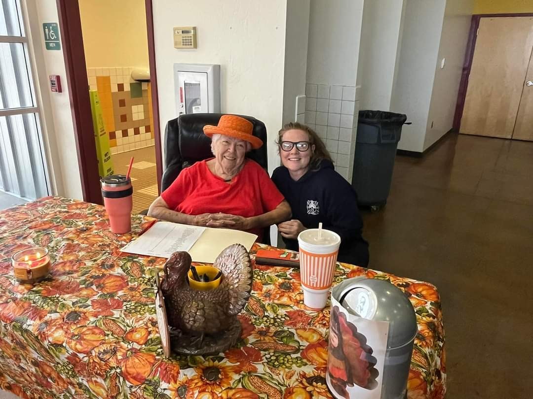 May contain: architecture, building, dining room, dining table, furniture, indoors, room, table, tablecloth, face, head, person, photography, portrait, adult, female, woman, tabletop, cup, and disposable cup