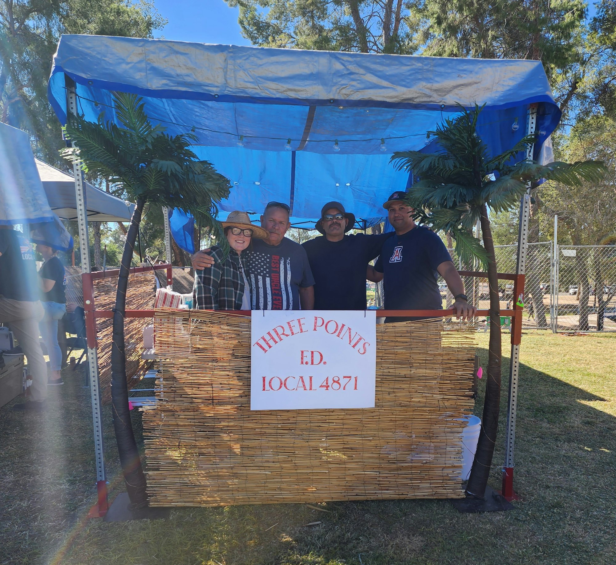 May contain: architecture, building, outdoors, shelter, people, person, plant, tree, face, head, photography, portrait, clothing, hat, adult, male, man, footwear, shoe, accessories, glasses, wood, wristwatch, house, housing, porch, t-shirt, kiosk, grass, nature, and park