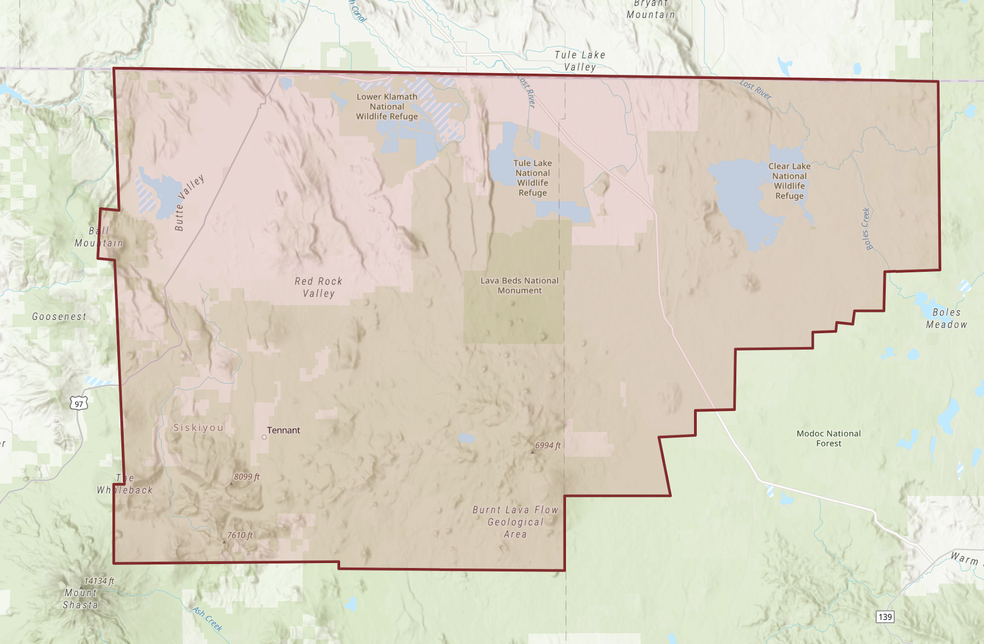 Map of a region with wildlife refuges, national monuments, valleys, and a national forest, outlined in red.