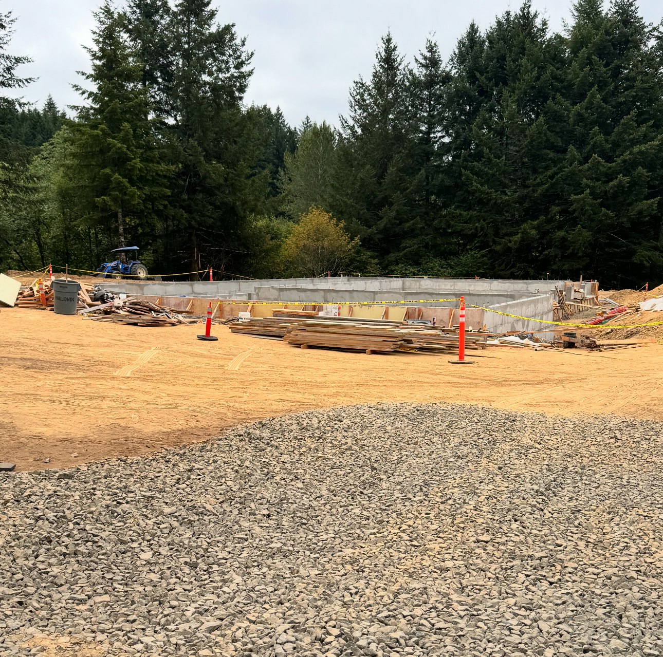Construction site showcasing newly poured concrete foundation,.