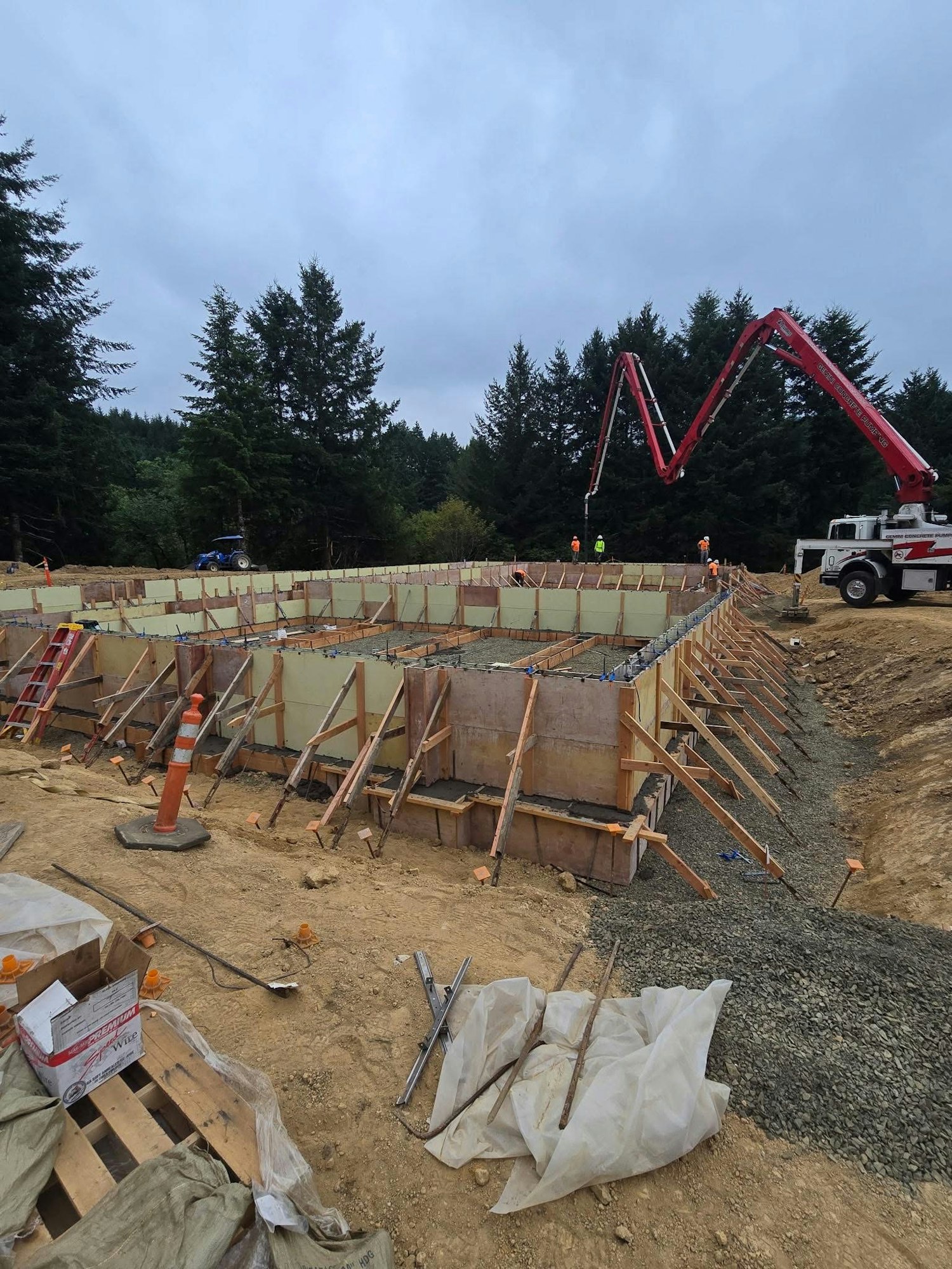 Construction foundation forms being poured