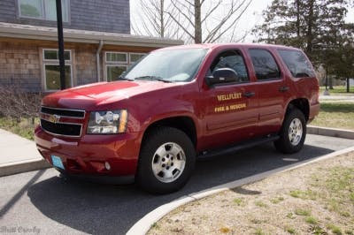 A black fire and rescue SUV parked outside a building.