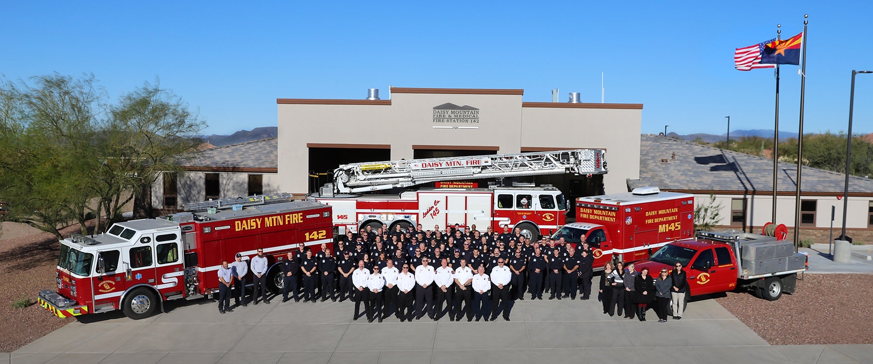 May contain: people, person, fire station, fire truck, transportation, truck, vehicle, machine, and wheel