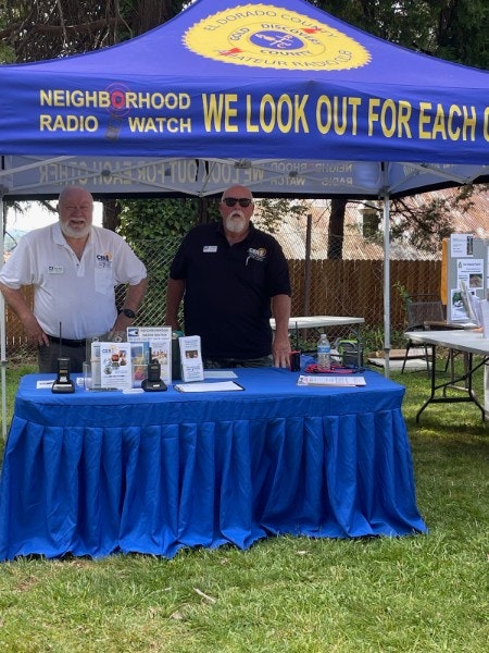 Goal Boal and JR Harmon staffing CERA's Neighborhood Radio Watch booth at National Night Out 2023