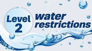 The image displays "Level 2 Water Restrictions," indicating guidelines for conserving water usage.