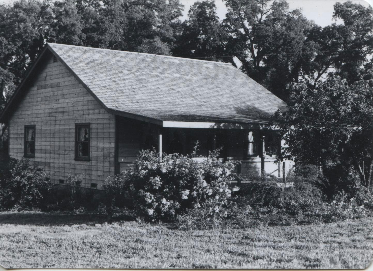 The original Buttermaker's Cottage, captured in black and white.