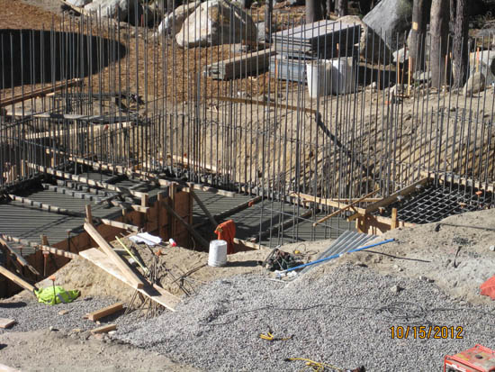 Construction site with rebar and gravel.