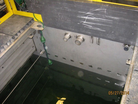 A water tank with pipes and equipment setup, dated May 27, 2014.