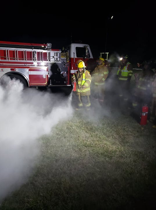 May contain: person, human, fire truck, transportation, vehicle, truck, and fireman