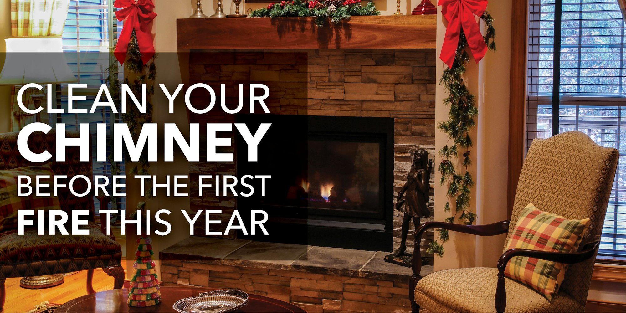 A cozy living room scene with a fireplace, urging to clean the chimney before the first fire of the year.