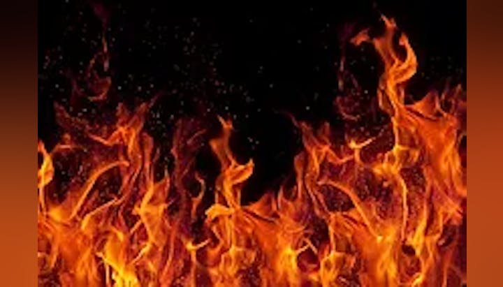 Dancing flames against a dark background.