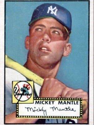 The image features a vintage baseball card of Mickey Mantle, showcasing him holding a bat, with the New York Yankees logo.