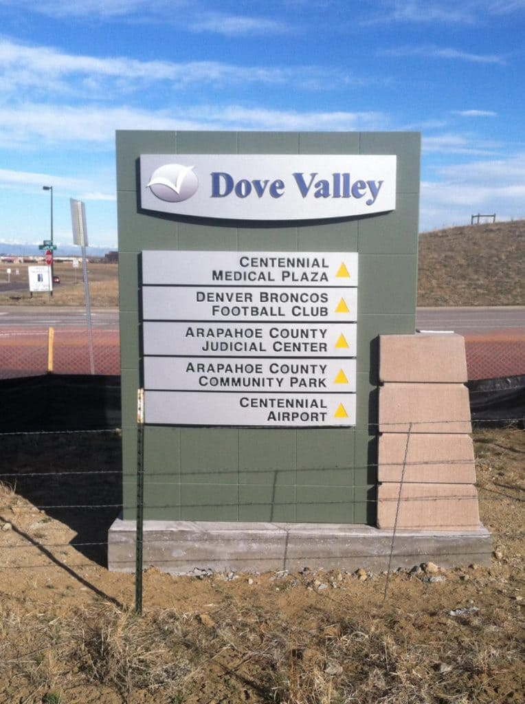 Sign for Dove Valley featuring directions to various local facilities, like medical plaza and airport.