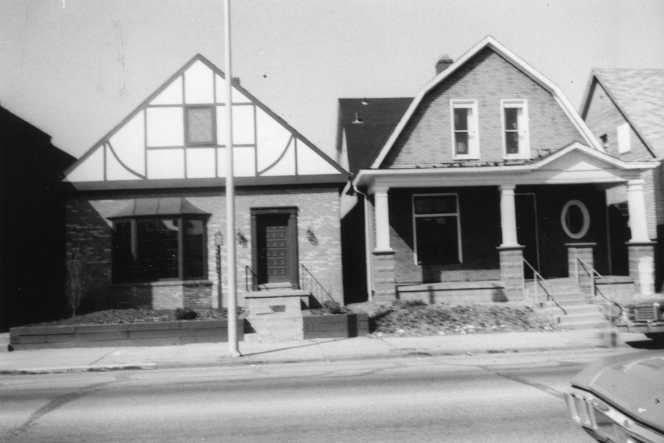 May contain: neighborhood, architecture, building, housing, car, transportation, vehicle, house, and portico