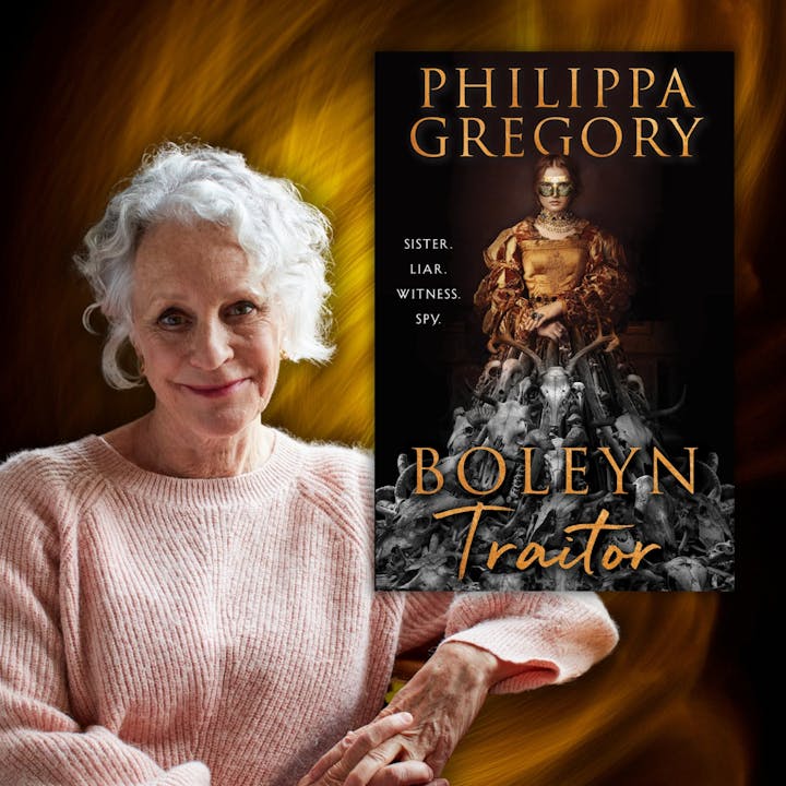 An elderly woman in a pink sweater next to the cover of "Boleyn Traitor" by Philippa Gregory.
