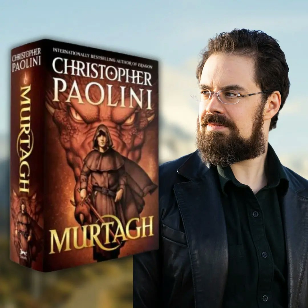 A person next to a book titled "MURTAGH" by Christopher Paolini.