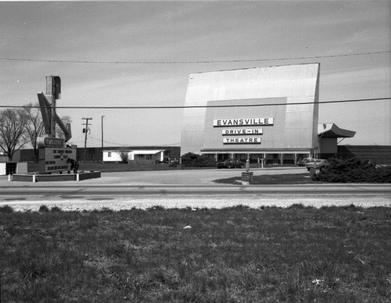 Vintage photo of Evansville Drive-In Theatre with large screen, marquee, and empty parking area.