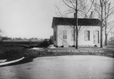Historic black and white photo of a small house with bare trees, dated Feb. 16, 1917.