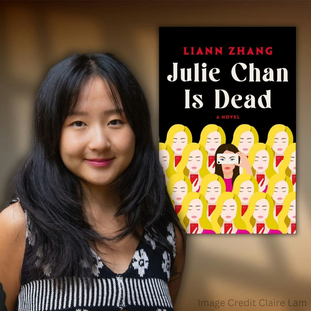 A person standing next to the book cover "Julie Chan Is Dead" by Liann Zhang.