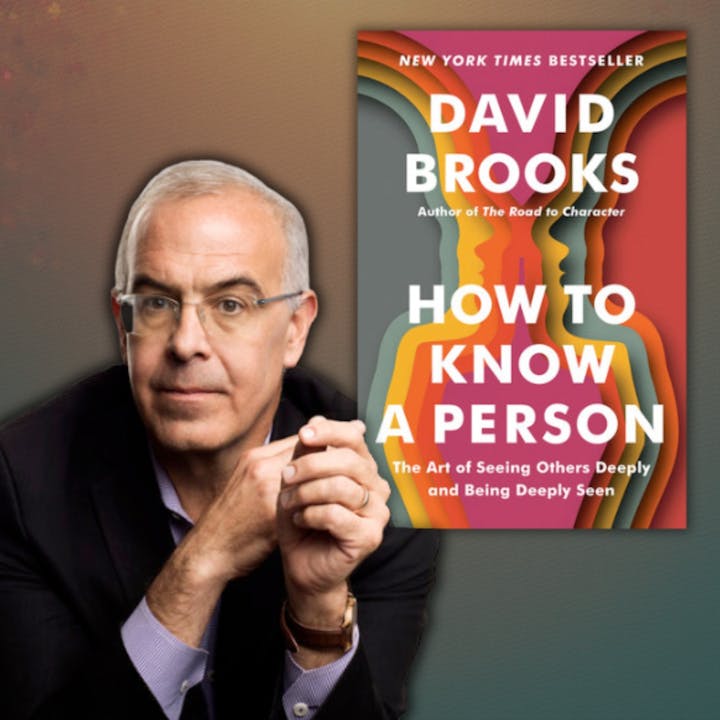 A man beside the book "How to Know a Person" by David Brooks, labeled as a New York Times Bestseller.