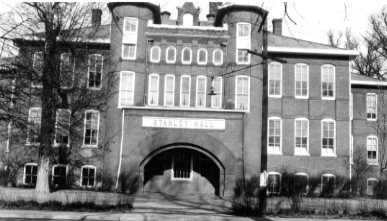 Black and white photo of an old building with "STANLEY HALL" over the entrance.