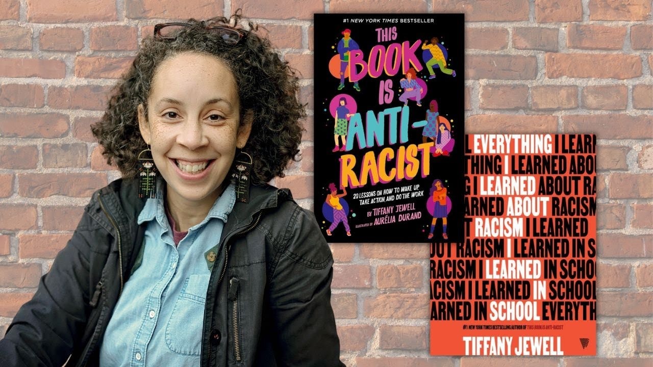 A person smiling, next to a cover of "This Book is Anti-Racist" by Tiffany Jewell. Brick wall background.