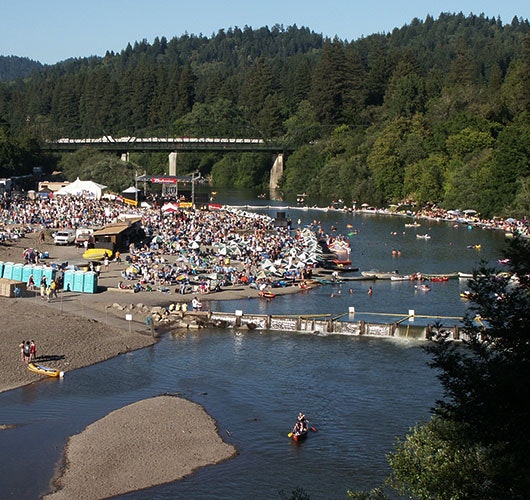 May contain: water, waterfront, car, transportation, vehicle, person, and crowd